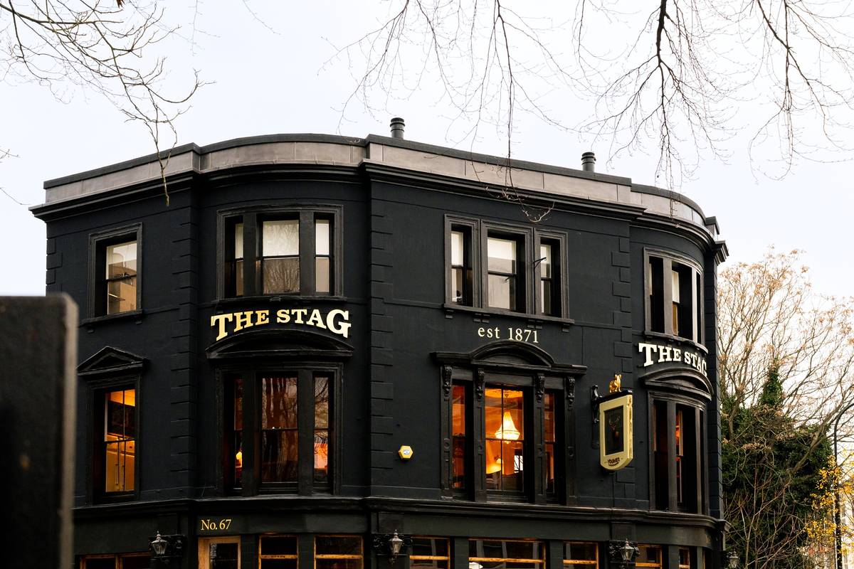 the black brick exterior of the stag pub in hampstead