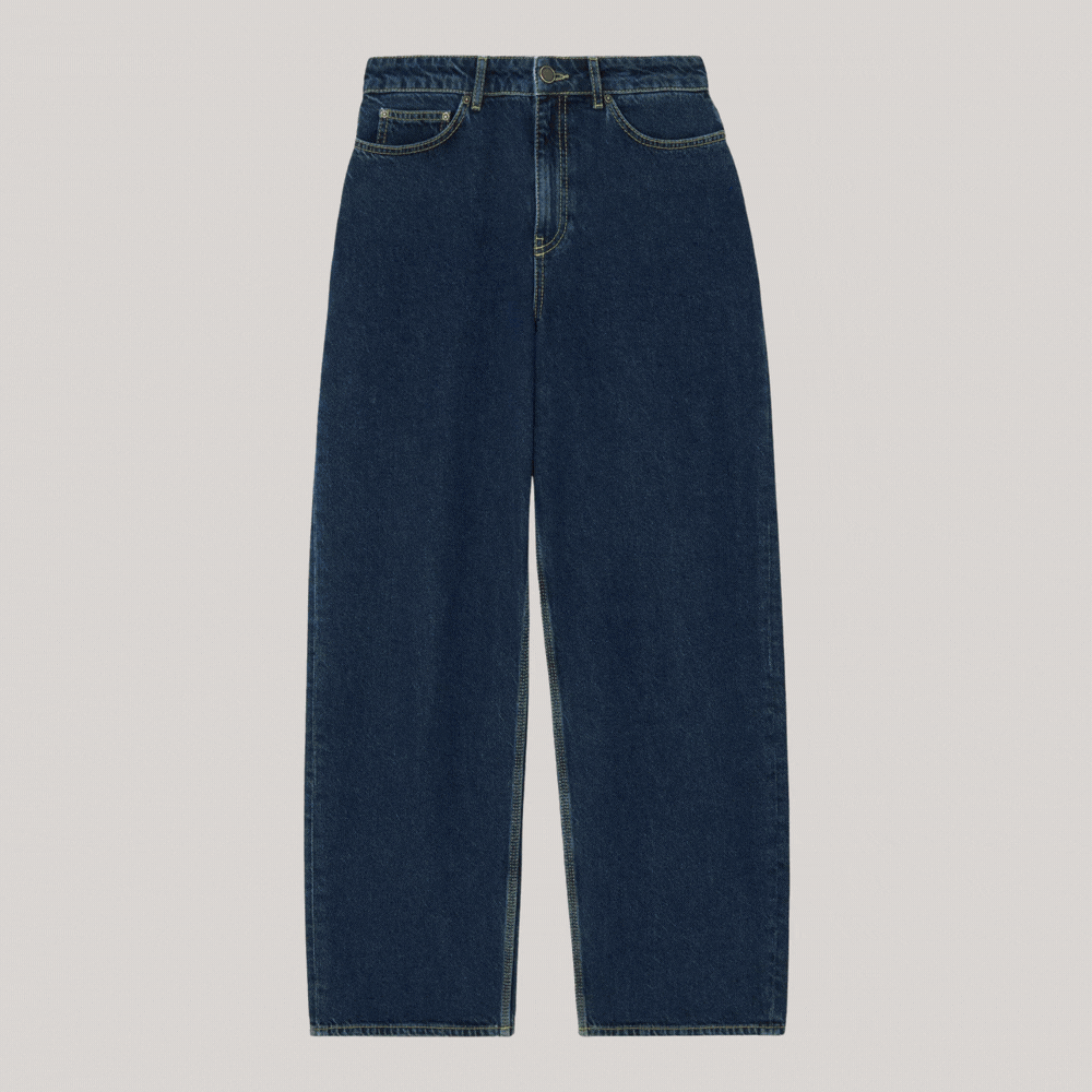 John Lewis x REJINA PYORelaxed Straight Cut High Rise Jeans shown in a rotating gif as laid bare on a pale gray background and worn by a model with a bright blue shirt.