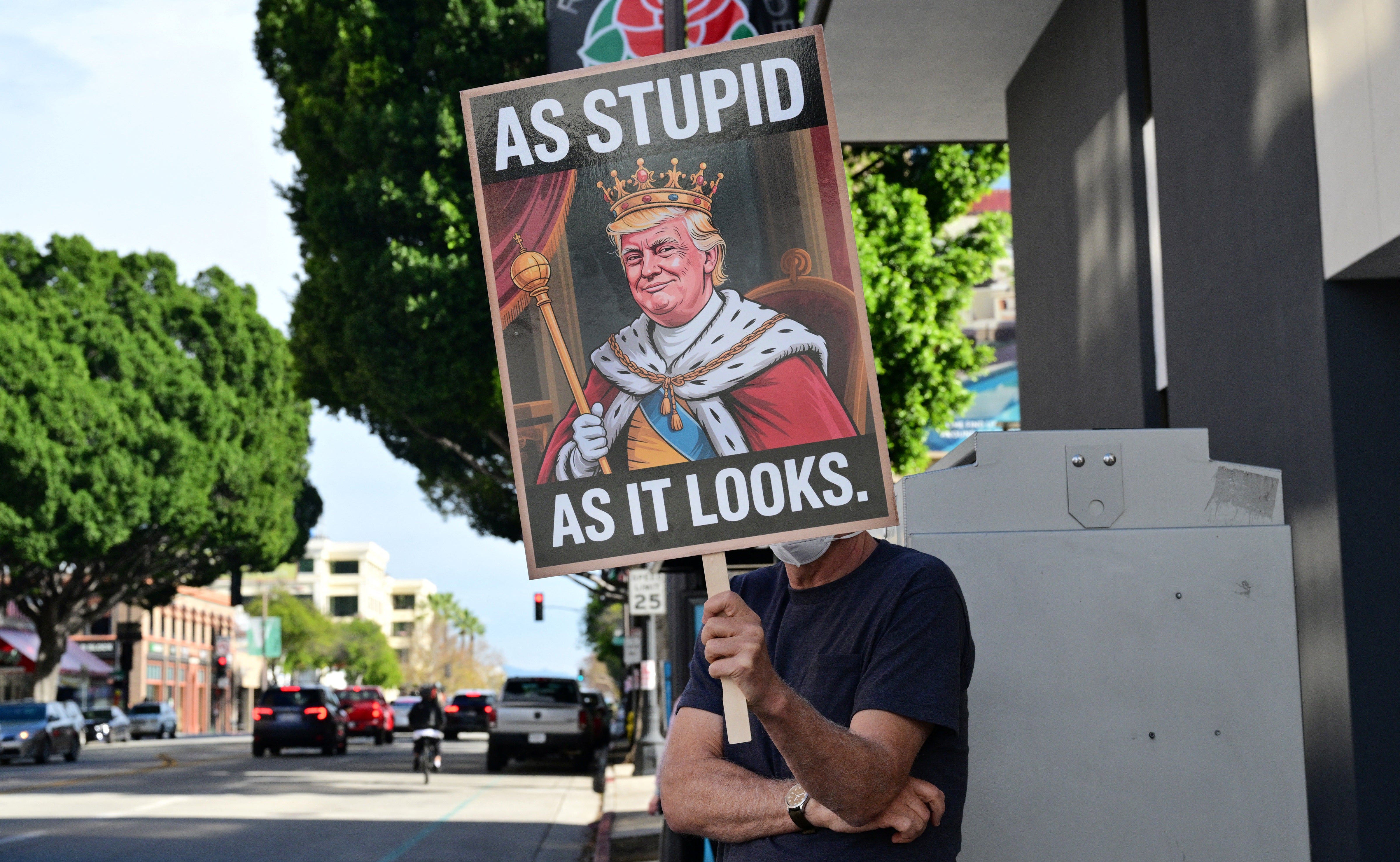 Activists gather to protest against US President Donald Trump's recent action in Venezuela on January 6, 2026 in Pasadena, California, calling on Congress for an immediate end to military action, accountability for President Trump's actions and diplomacy over war