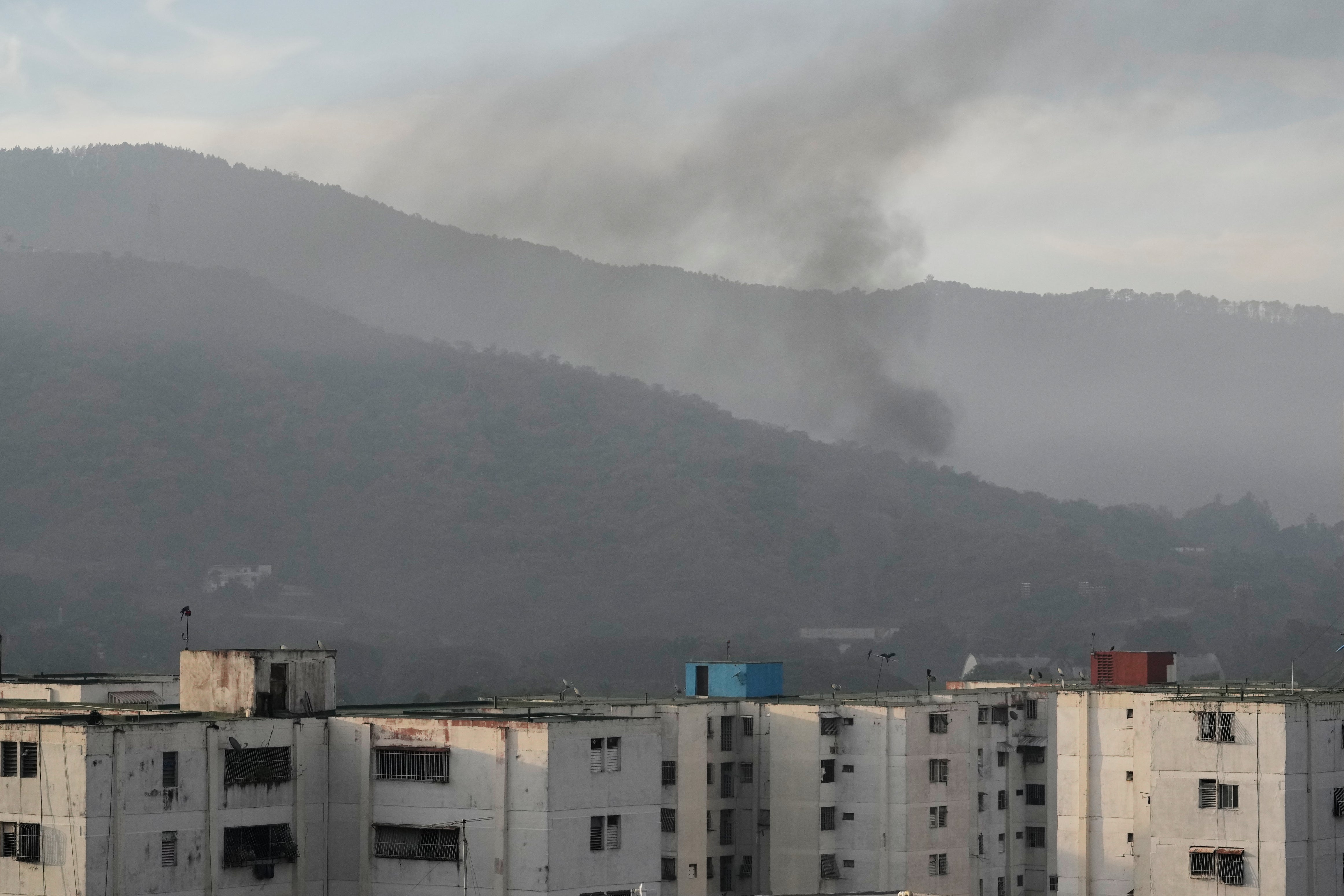 Smoke rises from Fort Tiuna, the main military garrison in Caracas, Venezuela