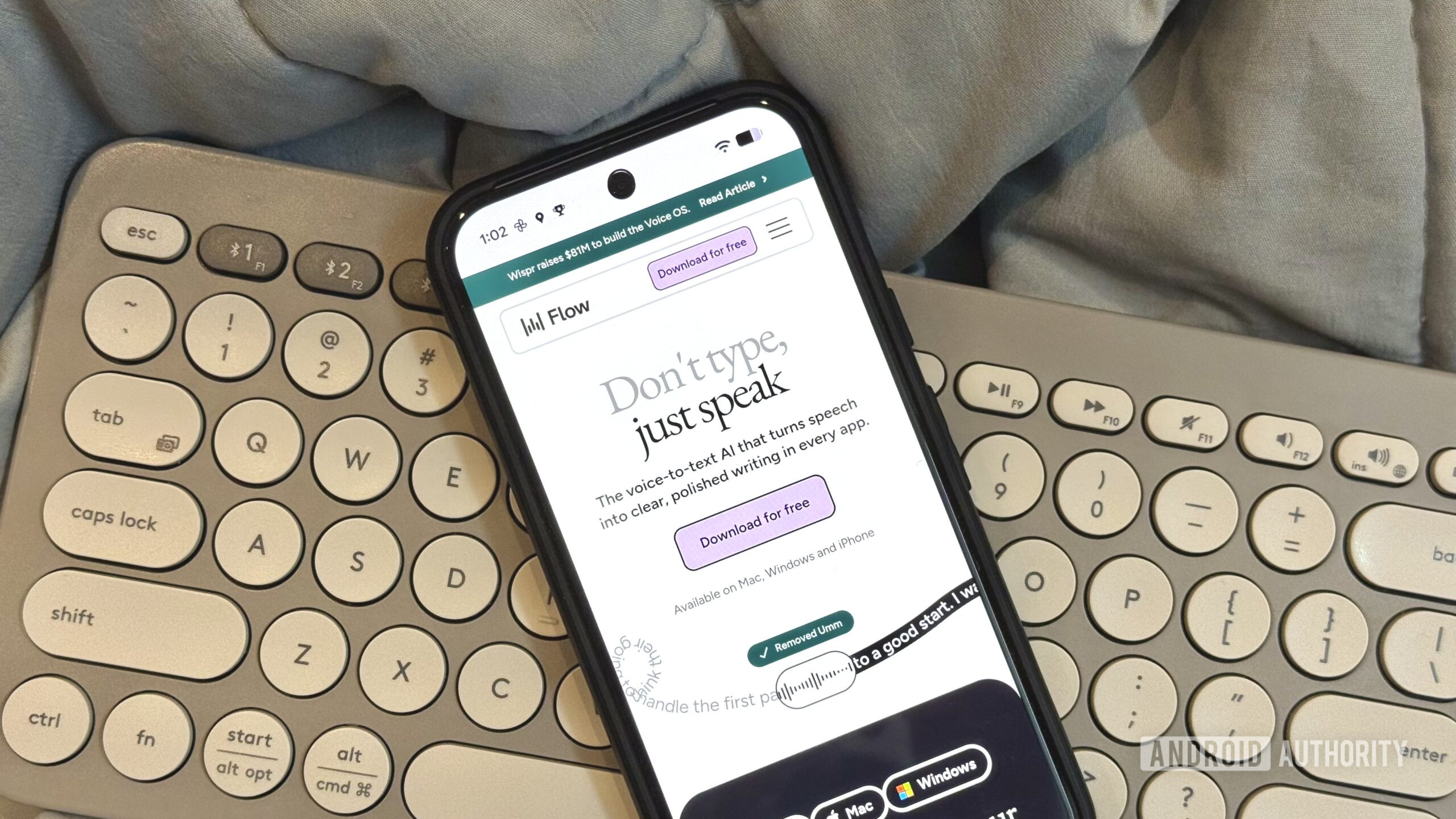 Wispr Flow AI voice dictation app's website open on a Pixel resting on a Logitech keyboard Wispr Flow AI voice dictation typing 2