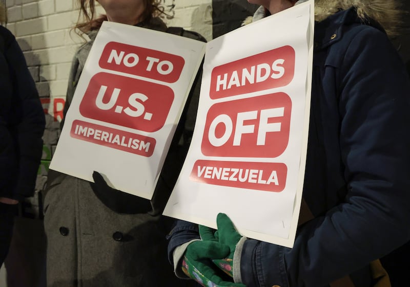 Protesters gather at the International Wall in Belfast amid recent US actions in Venezuela. PICTURE:BRIAN LINCOLN