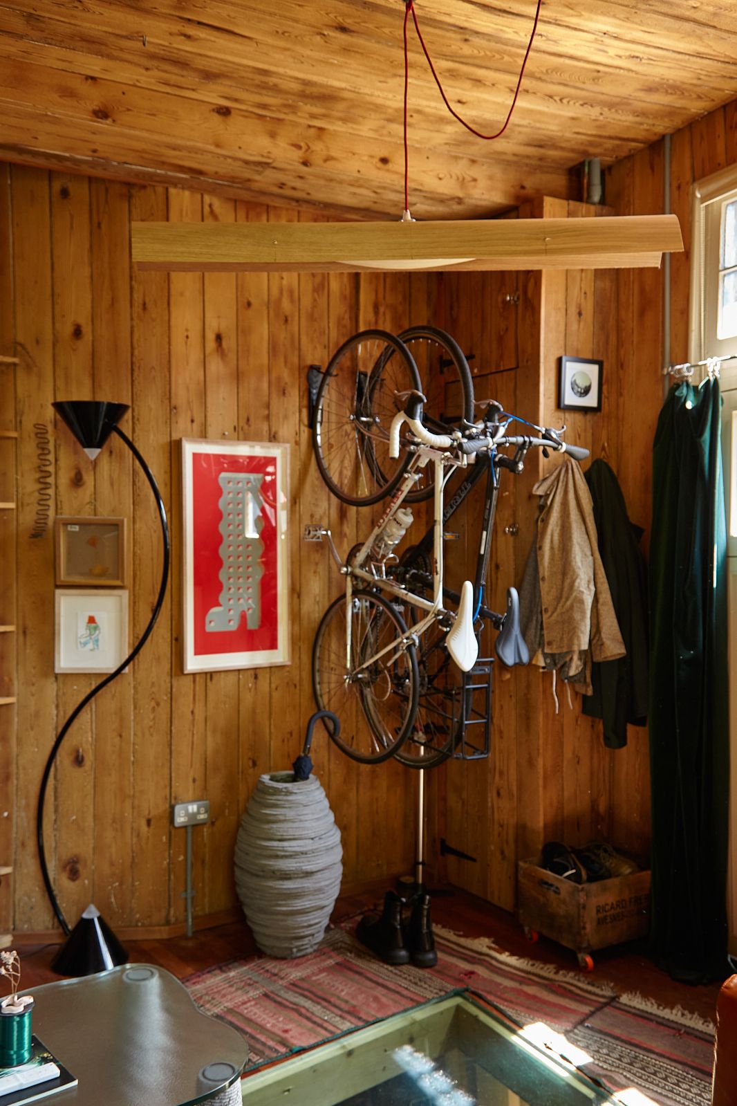 Image may contain Indoors Interior Design Wood Hardwood Home Decor Rug Stained Wood Desk Furniture and Table