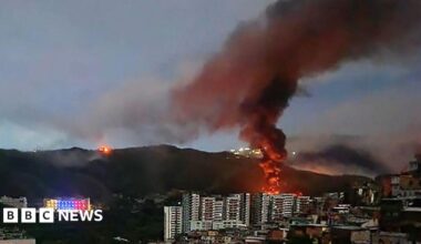 Fire at Fuerte Tiuna, Venezuela's largest military complex, is seen from a distance after a series of explosions in Caracas