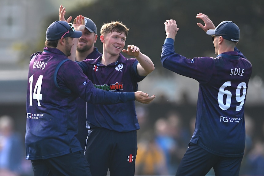 Scotland celebrate taking a wicket against Australia