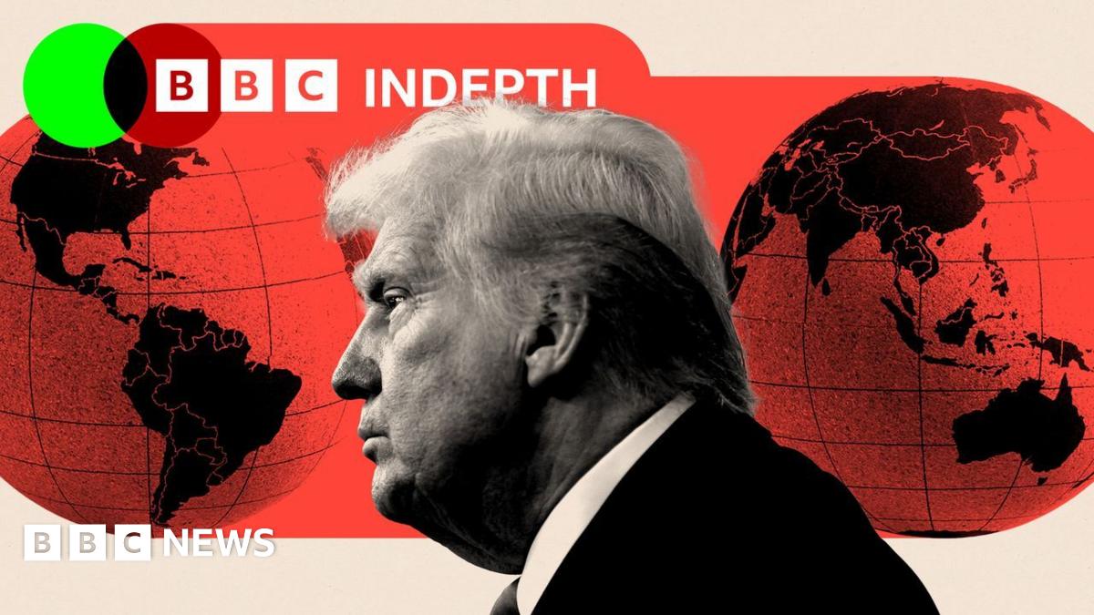 U.S. President Donald Trump looks on as he speaks to the press