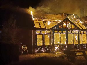 The Crooked House ablaze. 