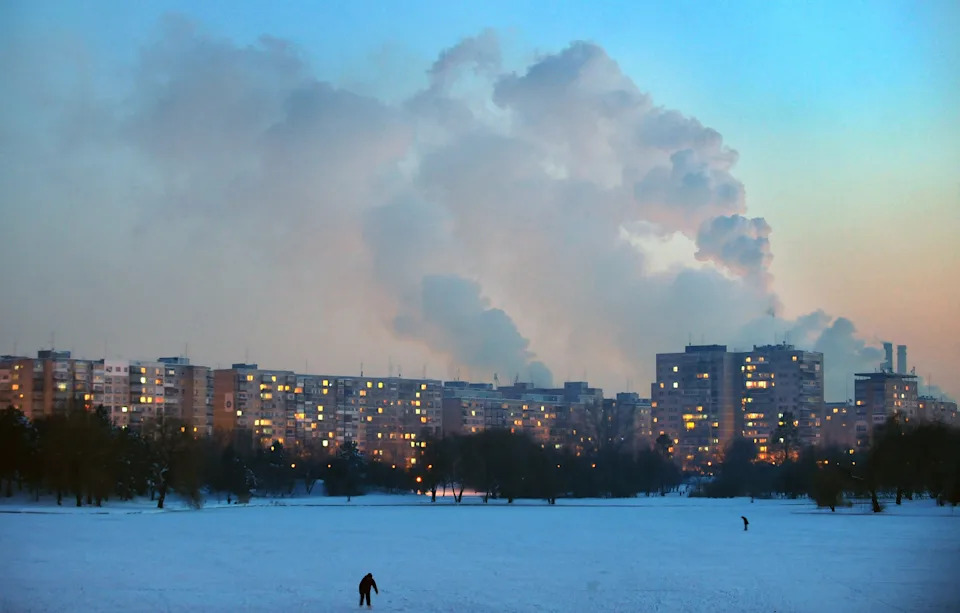 A general view of a frozen lake surrounded by blocks of flats in Bucharest on Jan. 25, 2010.
