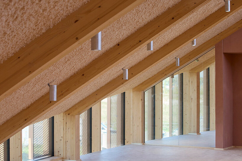 watch: ballet dancers take over BIG's circular timber building of dymak HQ in denmark