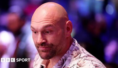 Luke Littler celebrates winning the 2026 PDC World Championship as tickertape falls