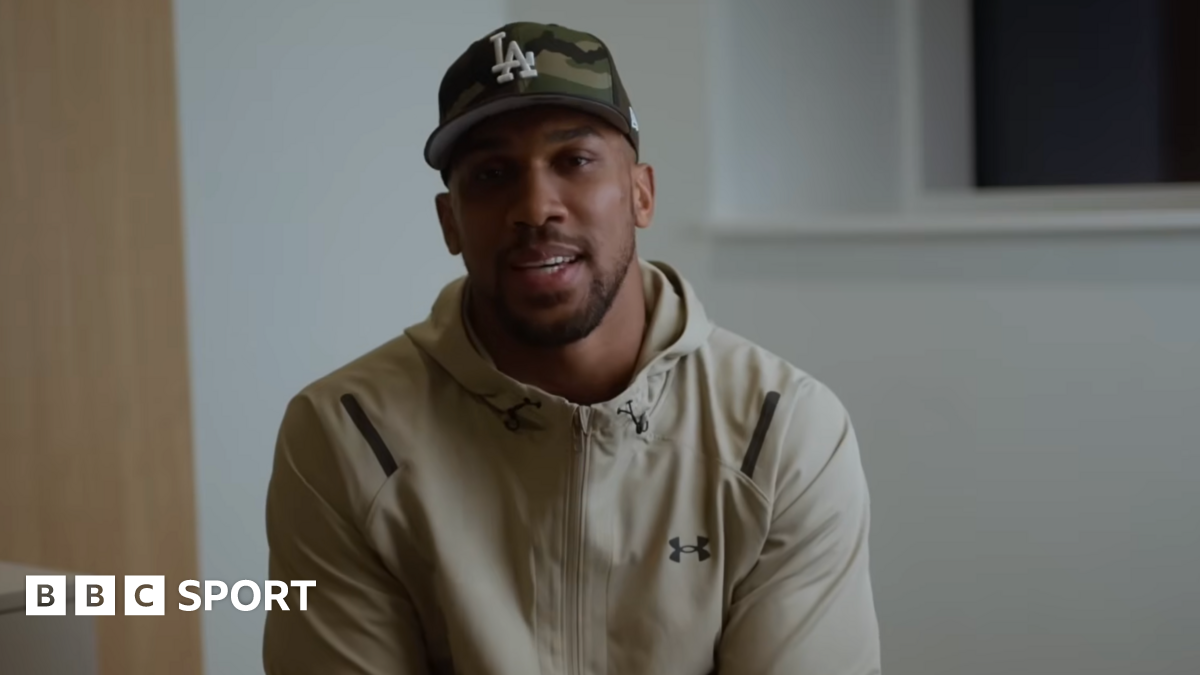 Anthony Joshua sits in front of a camera for a Youtube video