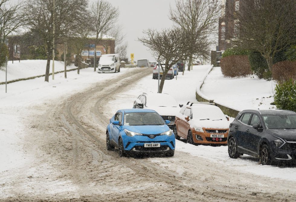 Cars travelling in the snow