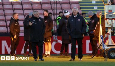 Sheffield United groundstaff inspect the pitch