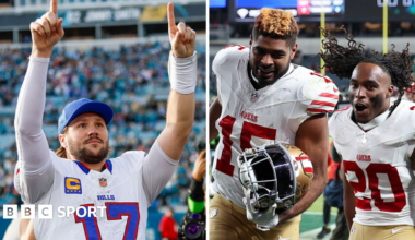 Josh Allen holds his arms aloft and Jauan Jennings celebrates with Upton Stout