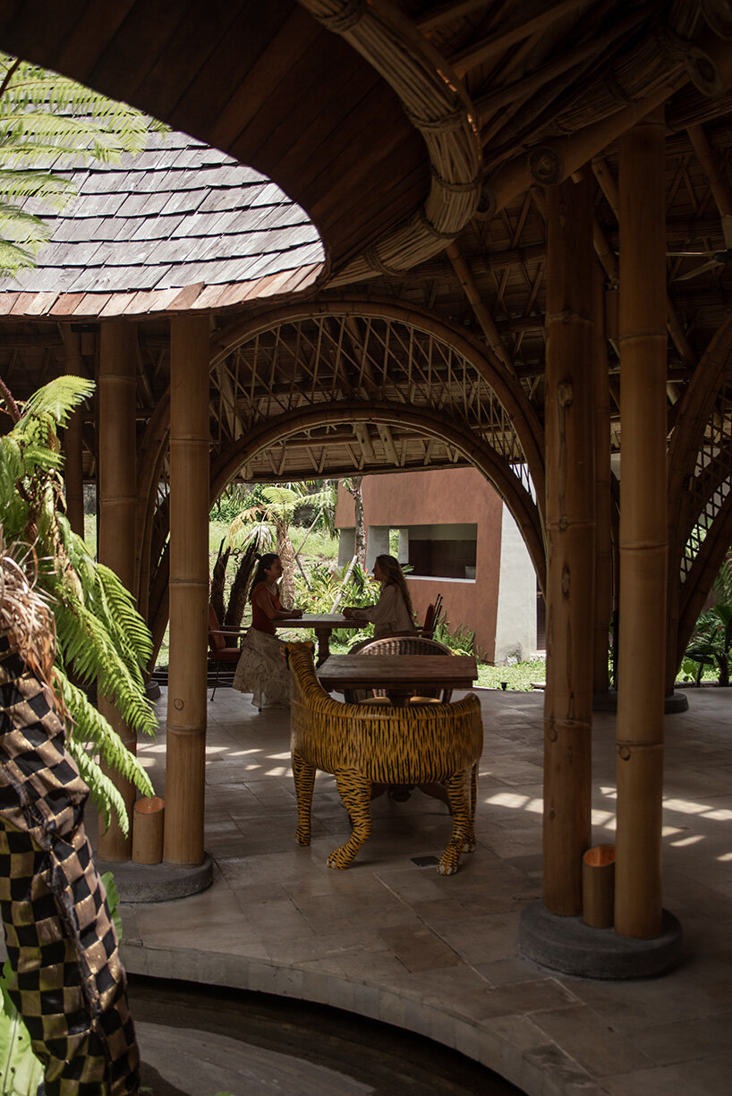 circular bamboo roof collects rainwater at balinese restaurant by pablo luna studio