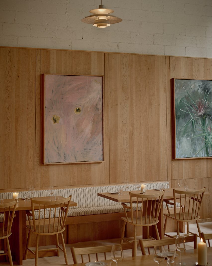 dining area with large colourful paintings