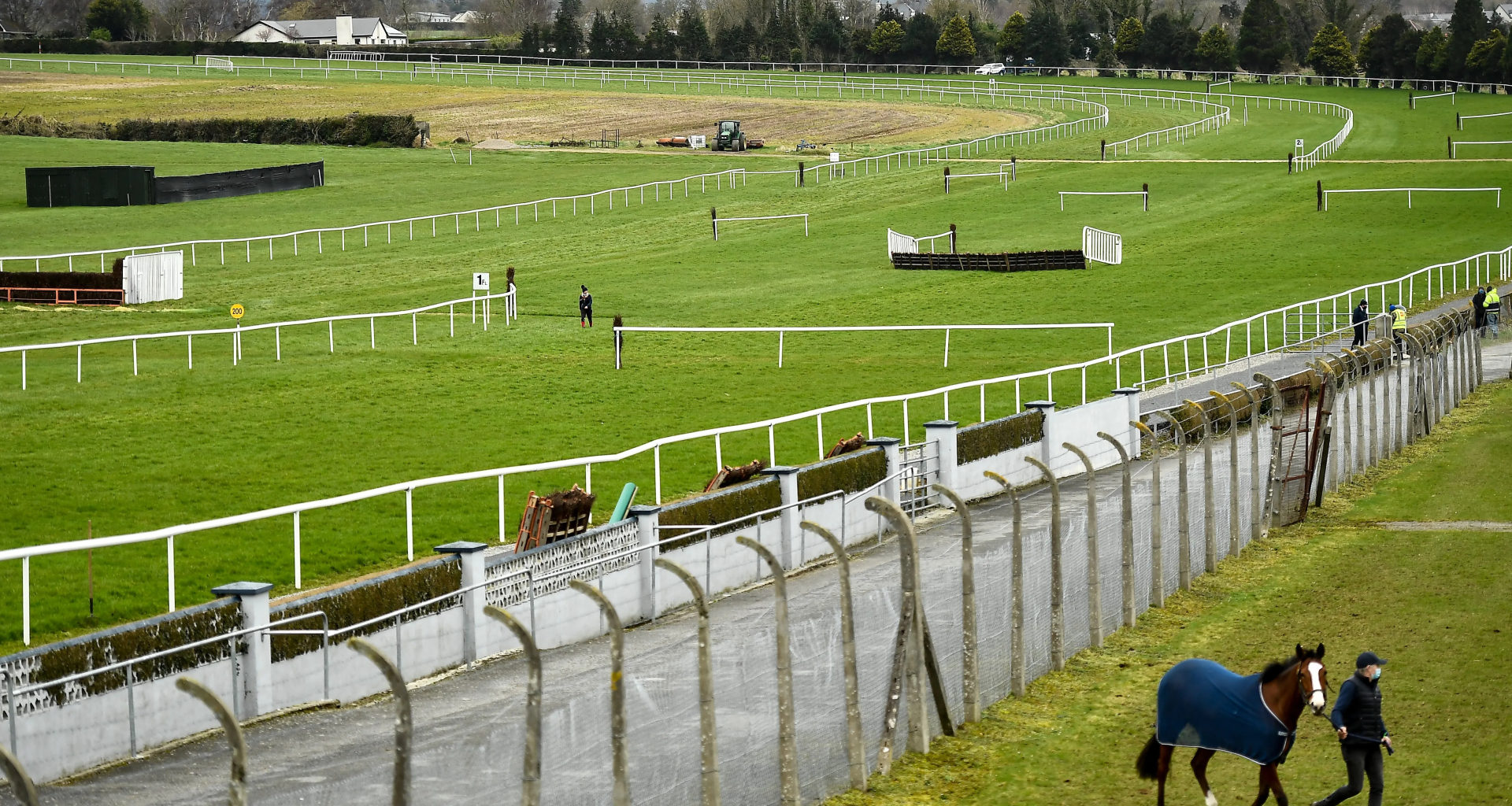 Jockey rushed to hospital with horror leg injury as races delayed