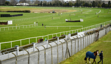 Jockey rushed to hospital with horror leg injury as races delayed