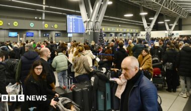 Passengers wait at the Thessaloniki Airport "Makedonia" amidst disruption in flights across Greece linked to a technical problem