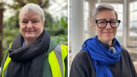 Fiona has short blonde hair and is wearing a dark scarf and high vis jacket. Sadie has short grey hair and glasses. She is wearing a dark blue scarf.