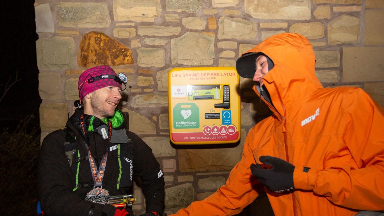 Damian Hall and Jack Scott at the finish line of the 2024 Montane Winter Spine Race.