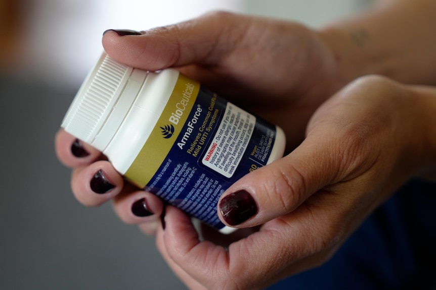 Hands holding bottle of ArmaForce.