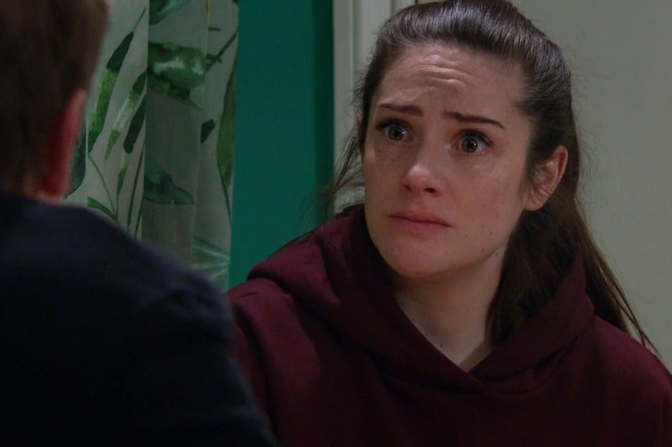 Emmerdale Victoria Sugden two individuals engaged in conversation in an indoor setting