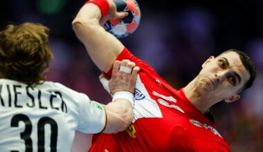 Serbia shock Germany to remain in main round race