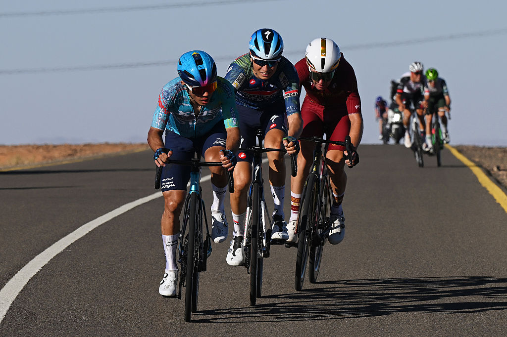 SKYVIEWS OF HARRAT UWAYRID, SAUDI ARABIA - JANUARY 31: (L-R) Sergio Higuita of Colombia and XDS Astana Team, Mauri Vansevenant of Belgium and Team Soudal Quick-Step and Byron Munton of South Africa and Team Modern Adventure Pro Cycling attack during the 6th AlUla Tour 2026, Stage 5 a 163.9km stage from AlUla Old Town to Skyviews of Harrat Uwayrid 1166m on January 31, 2026 in Harrat Uwayrid, Saudi Arabia. (Photo by Dario Belingheri/Getty Images)