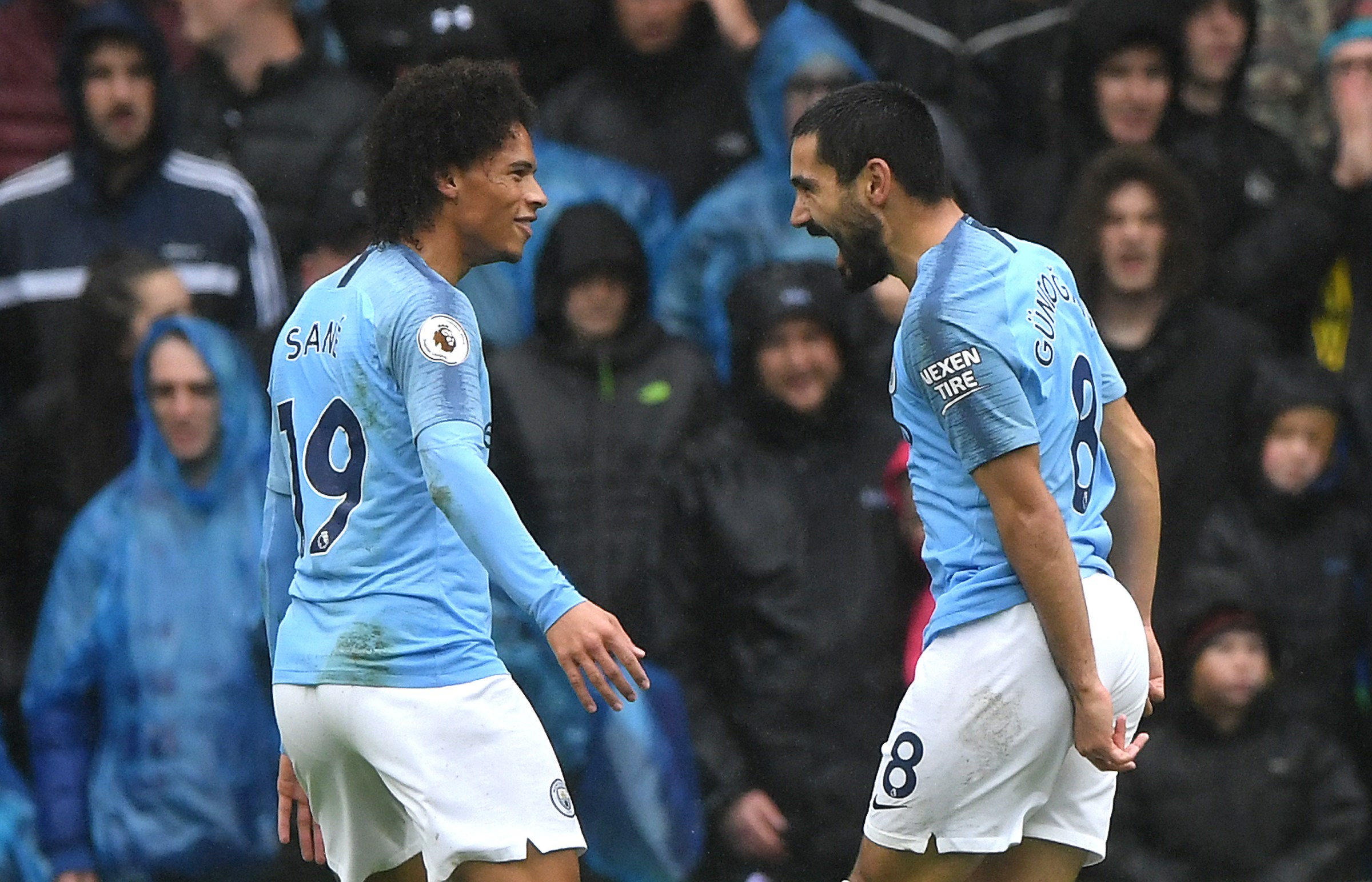 CARDIFF, WALES - SEPTEMBER 22: Ilkay Gundogan of Manchester City celebrates with teammate Leroy Sane after scoring his team’s third goal during the Premier League match between Cardiff City and Manchester City at Cardiff City Stadium on September 22, 2018 in Cardiff, United Kingdom. (Photo by Stu Forster/Getty Images)