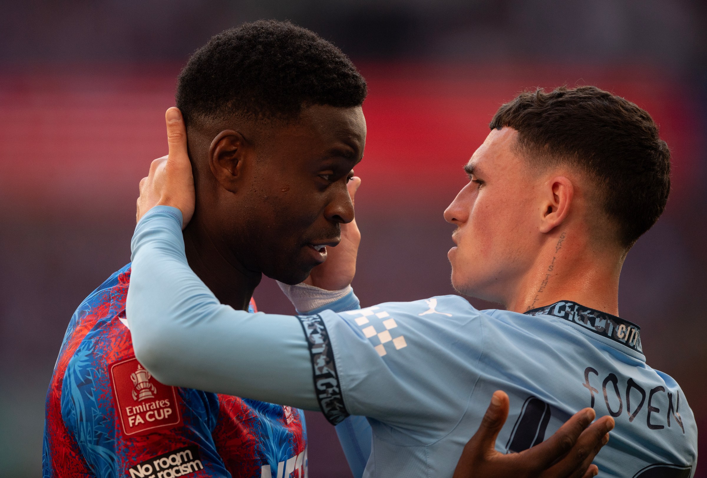 LONDON, ENGLAND - MAY 17: Marc Guehi of Crystal Palace and Phil Foden of Manchester City embrace after the Emirates FA Cup Final match between Crystal Palace and Manchester City at Wembley Stadium on May 17, 2025 in London, England. (Photo by Visionhaus/Getty Images)