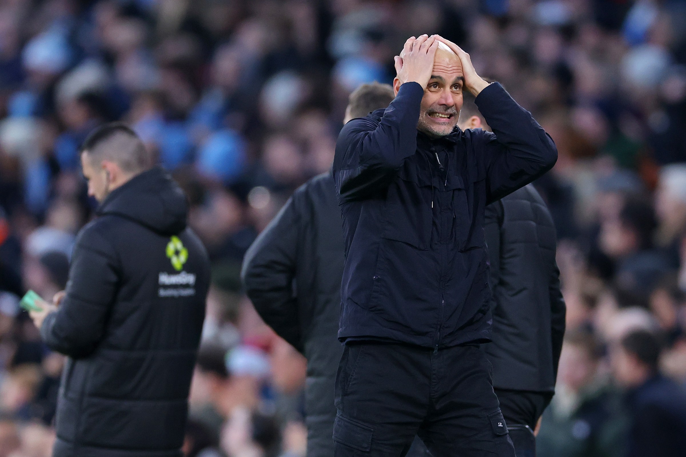 MANCHESTER, ENGLAND - DECEMBER 20: Pep Guardiola, Manager of Manchester City, reacts to his team’s second goal scored by Tijjani Reijnders (not pictured) during the Premier League match between Manchester City and West Ham United at Etihad Stadium on December 20, 2025 in Manchester, England. (Photo by Molly Darlington/Getty Images)