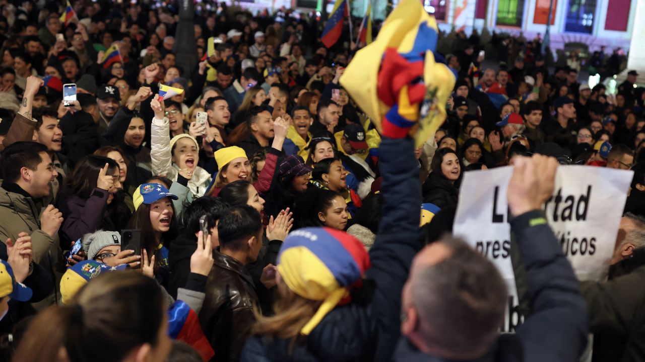 Protesters gather at Puerta del Sol square during a demonstration demanding freedom for Venezuela, following the US military operation in Venezuela to capture the Venezuelan president, in Madrid on January 4, 2026.