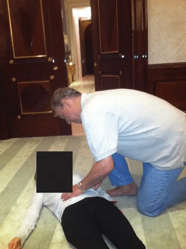 Andrew appears to be touching a woman's abdomen in the images