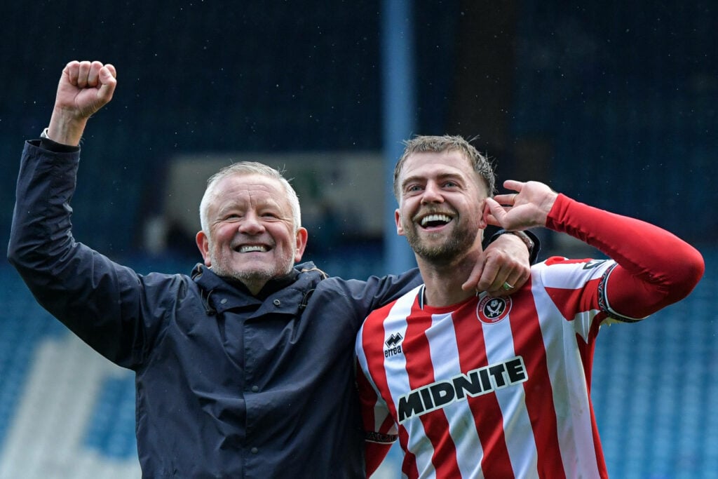 Chris Wilder and Patrick Bamford celebrate a Sheffield United victory over Sheffield Wednesday.