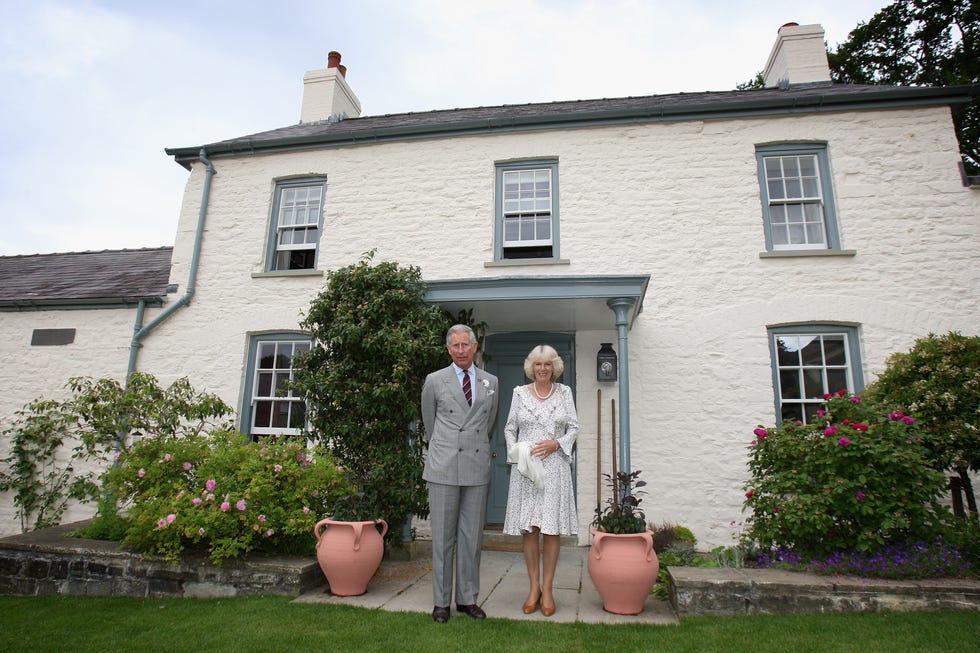 king charles and queen camilla pose outside of ﻿llwynywermod in 2009, ahead of hosting a drinks reception on the property