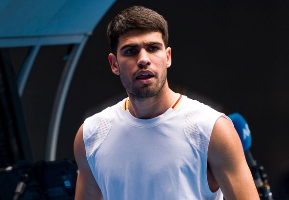 Carlos Alcaraz looks on