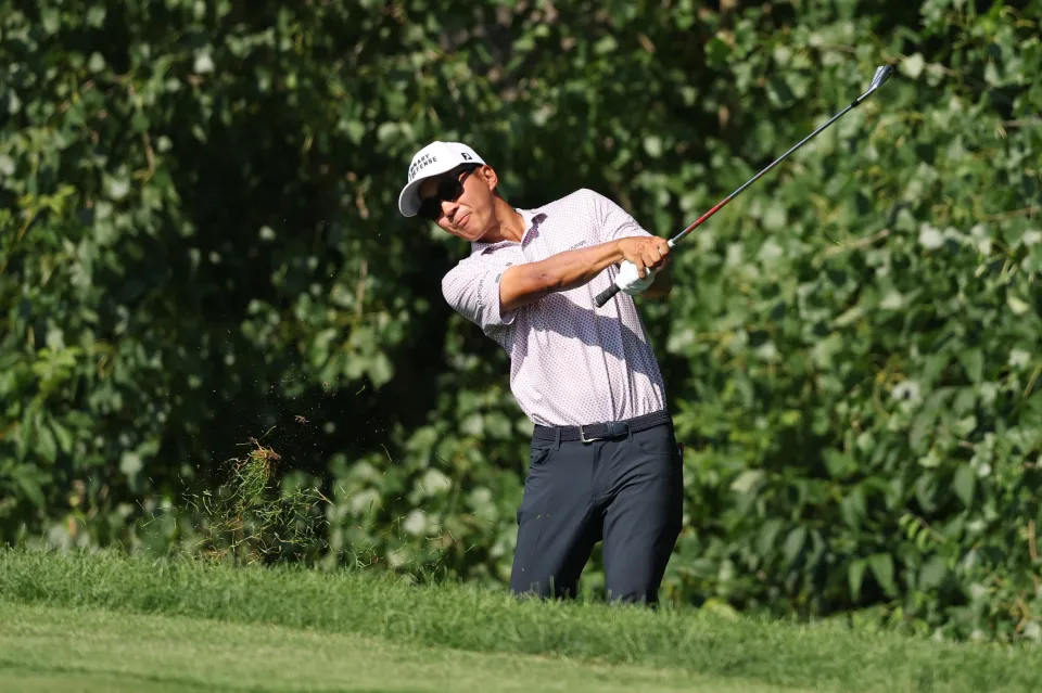 Michael Kim of the United States plays a shot on the 15th hole during the second round of the John Deere Classic 2025 at TPC Deere Run on July 04, 2025 in Silvis, Illinois.
