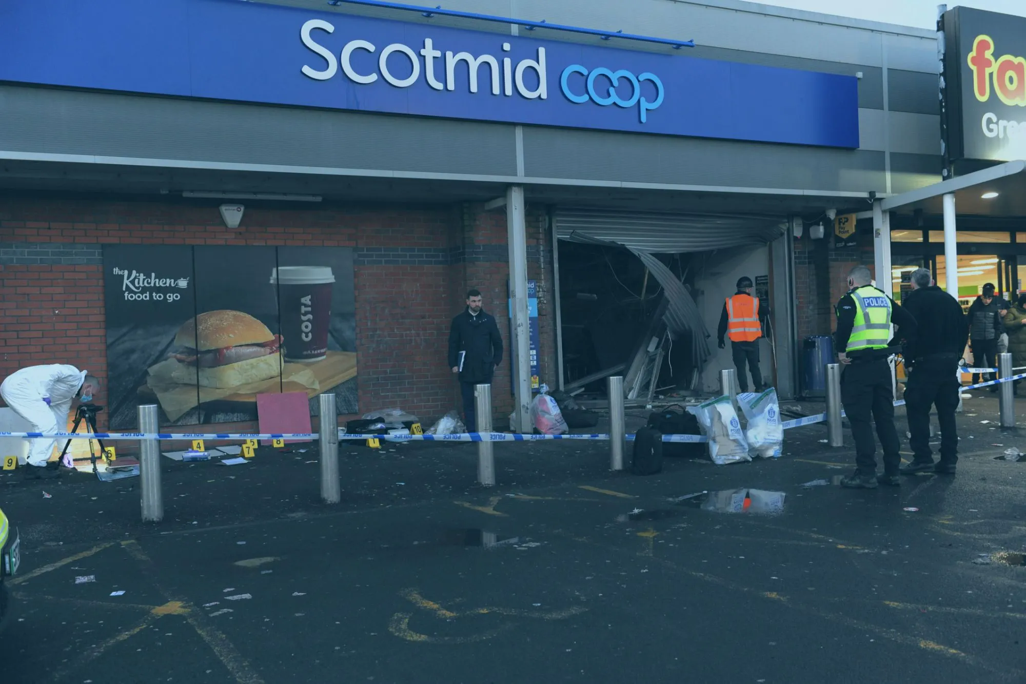 An image collage containing 1 images, Image 1 shows Police investigate an ATM robbery at a Scotmid Co-op store