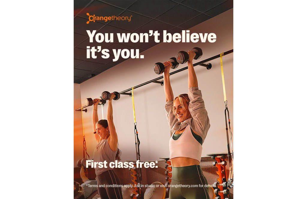 Orange Theory promotion showing two women lifting weights.