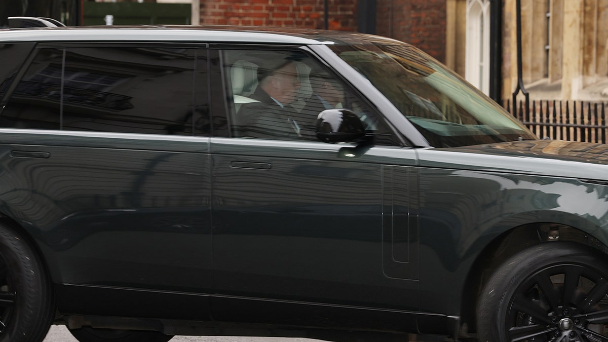 A car believed to have Prince Andrew in the backseat arriving to Princess Beatrice's daughter's christening.