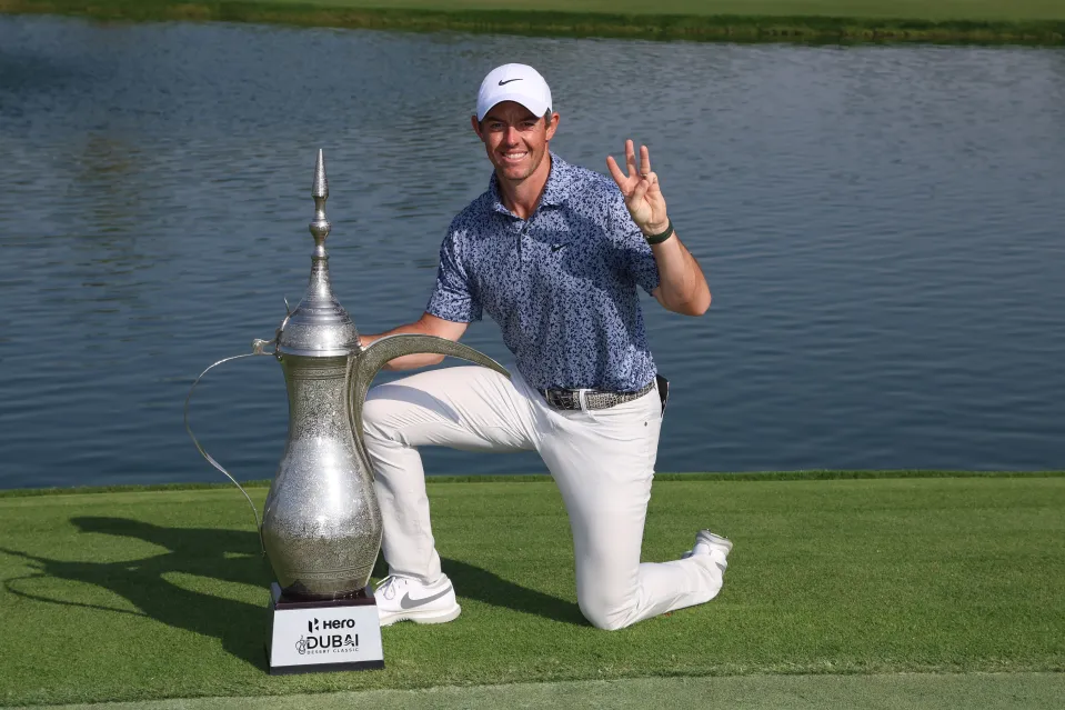 Rory McIlroy of Northern Ireland poses with the Hero Dubai Desert Classic trophy on the 18th green, following victory in the Final Round on Day Five of the Hero Dubai Desert Classic at Emirates Golf Club on January 30, 2023 in Dubai, United Arab Emirates.