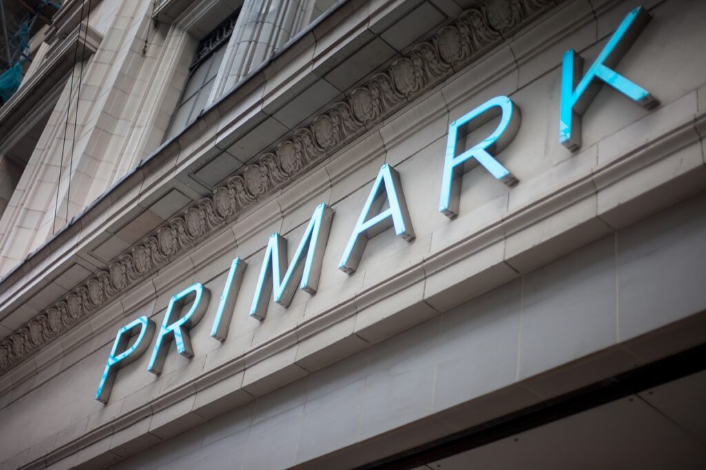 a blue-lettered sign for primark