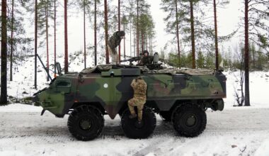 Members of the British army and Finnish army in an armoured vehicle during a NATO exercise in Finland. Pic: PA
