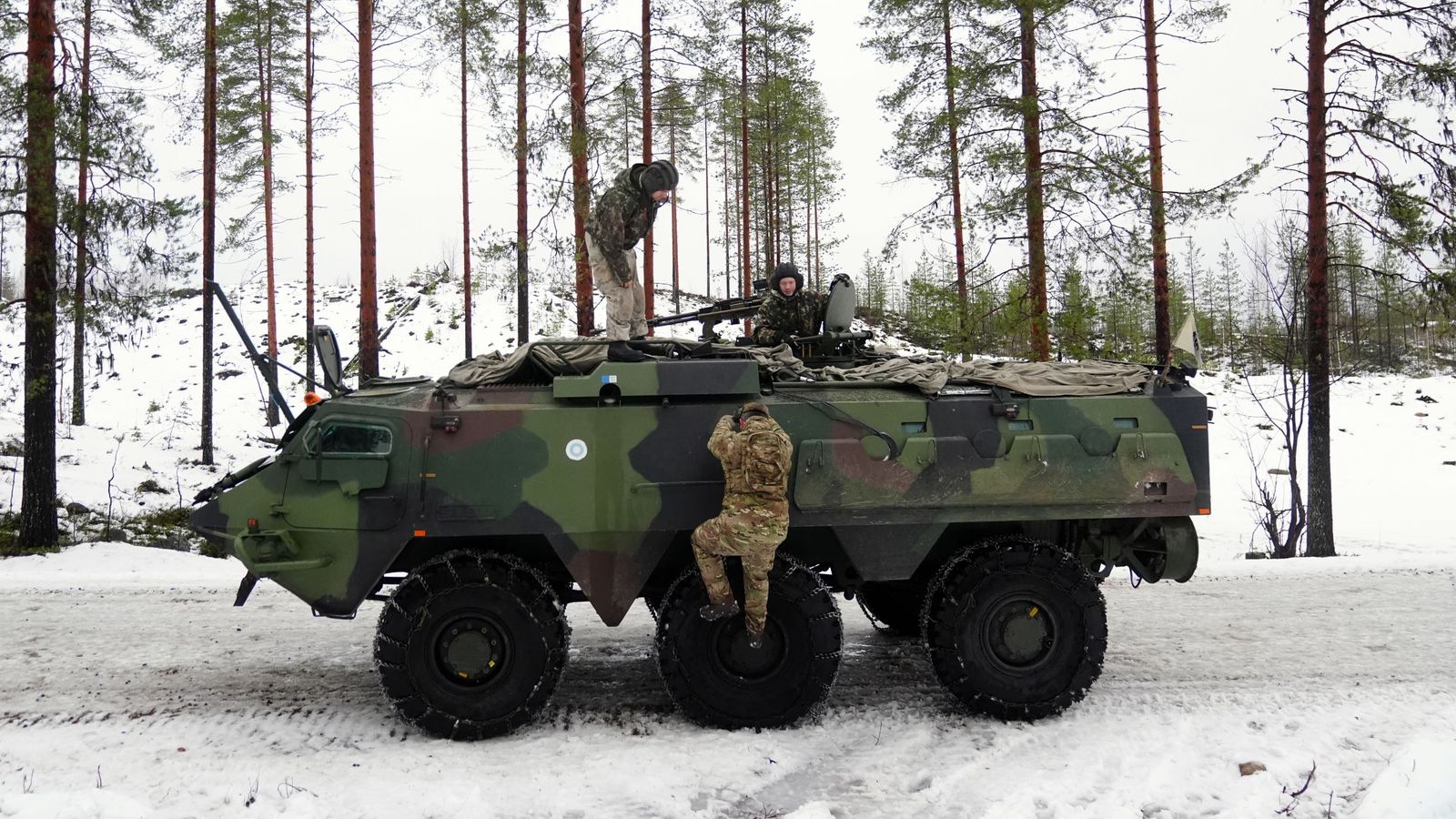 Members of the British army and Finnish army in an armoured vehicle during a NATO exercise in Finland. Pic: PA