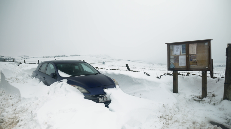 Car stuck in snow in Derbyshire following Storm Goretti