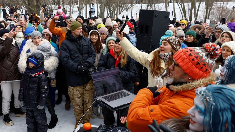 An outdoor party to warm up and collect donations for the Ukrainian armed forces in Kyiv. Pic: Reuters