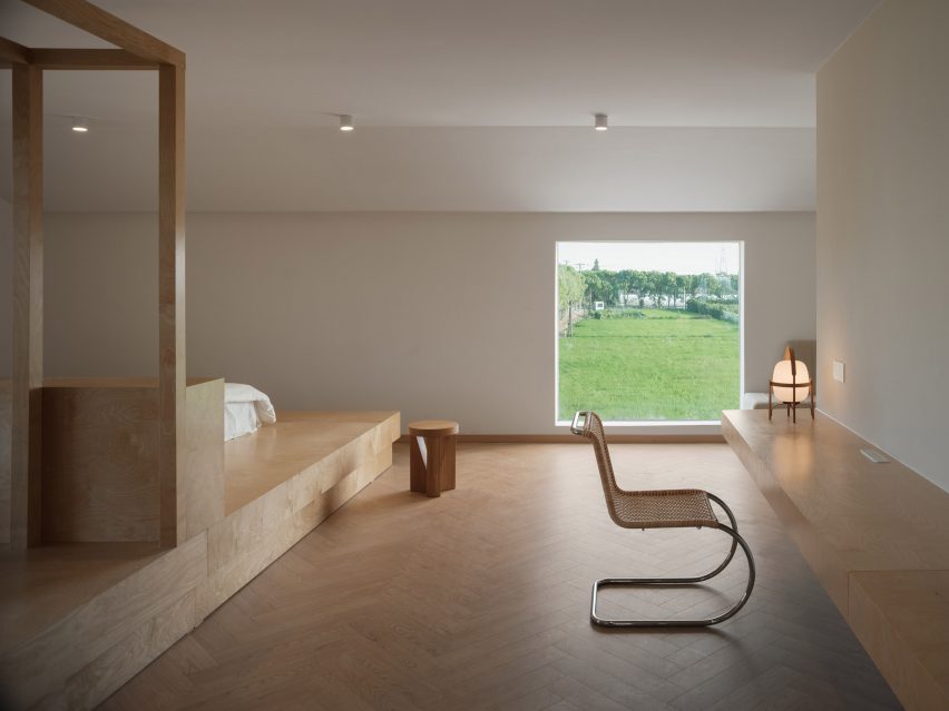 Guest room with wooden floors and furnishings 