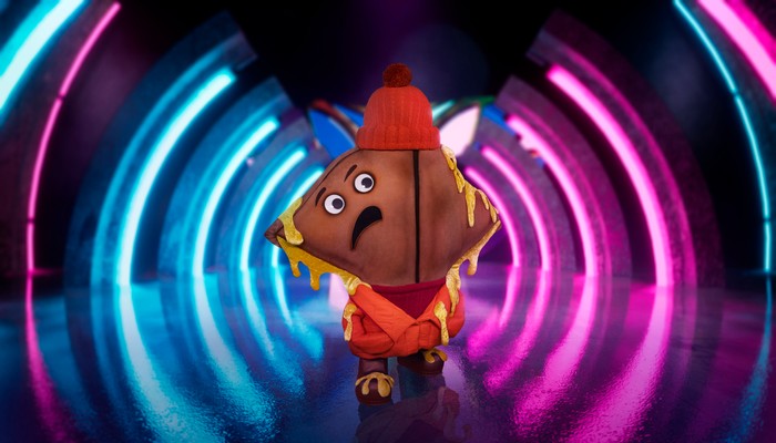 ©ITV Plc Someone dressed as a cheese toastie with an upset face.