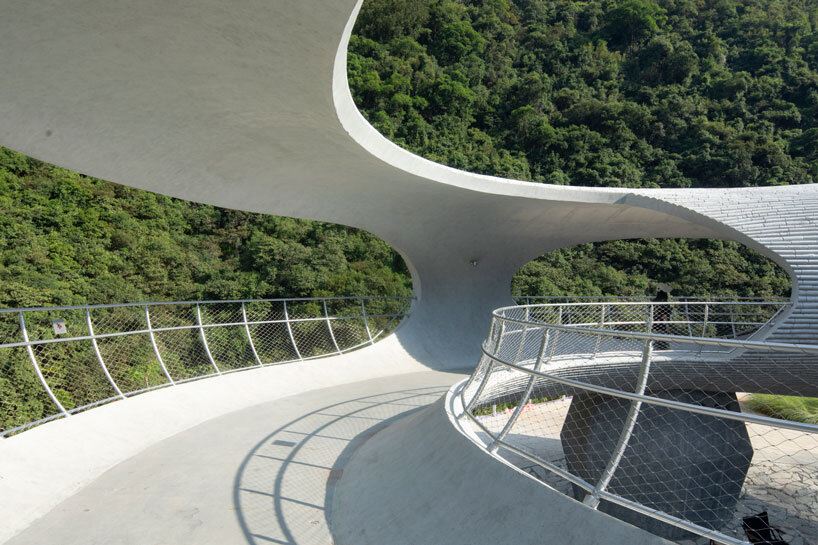 tubular concrete ring by HCCH studio shapes cycling rest pavilion among chinese hills